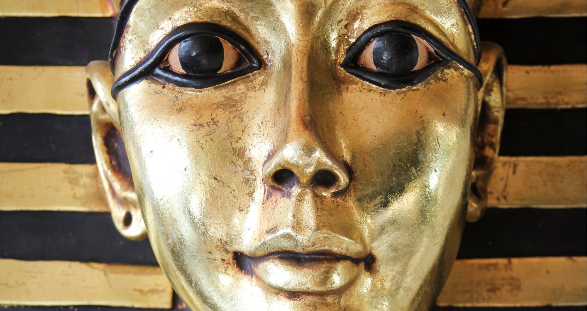 Cosmetic Services - the face of an Egypt figure, it is golden