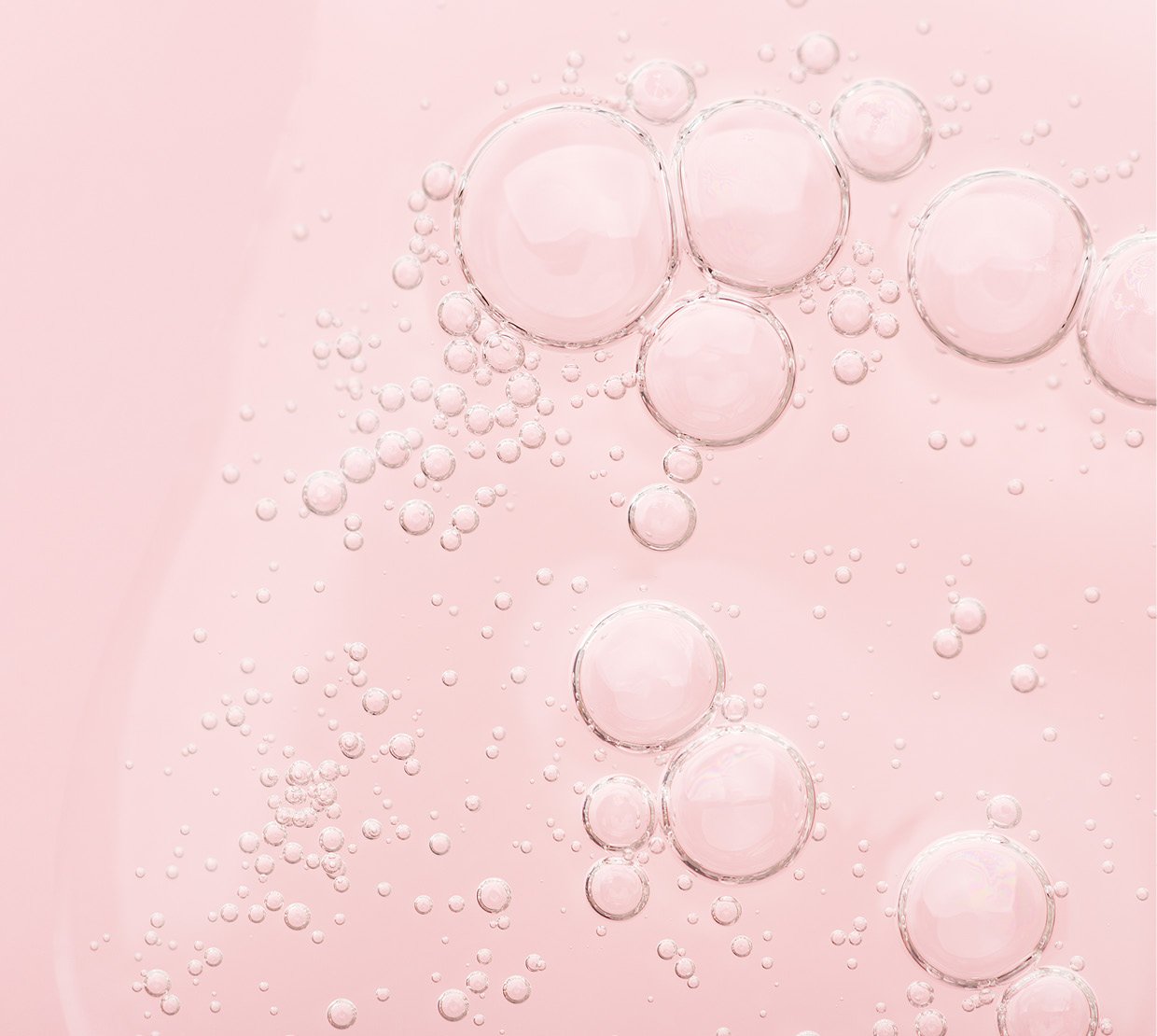 Cosmetic Services - pink liquid solution with droplets