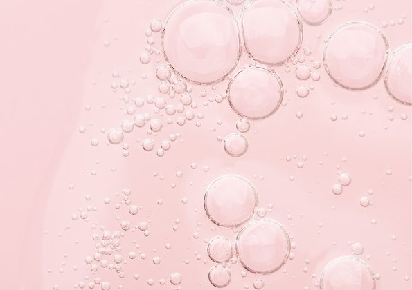 Cosmetic Services - pink liquid solution with droplets